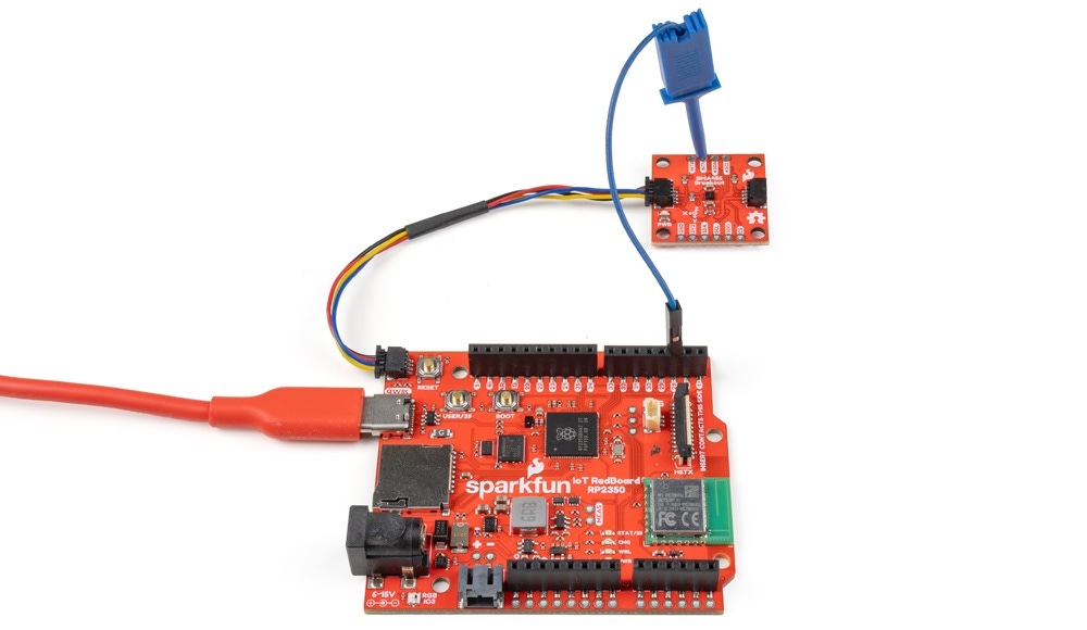 A SparkFun Triple Axis Accelerometer Breakout - BMA456 (Qwiic) connected to an RP2350 IoT RedBoard with its interrupt pin activated.