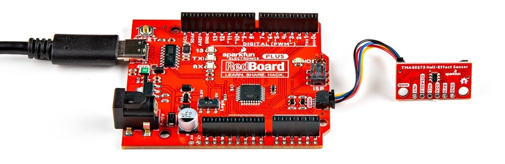The Qwiic Mini Hall-Effect Sensor is connected to a RedBoard Plus, with a Qwiic cable.