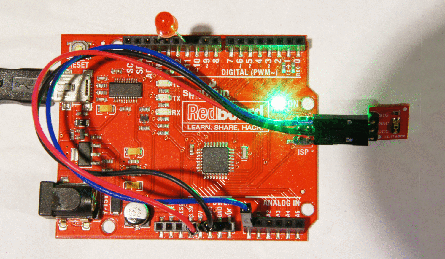 An example of the SparkFun Ambient Light Sensor Breakout turning an LED on and off depending on the lux it is detecting.