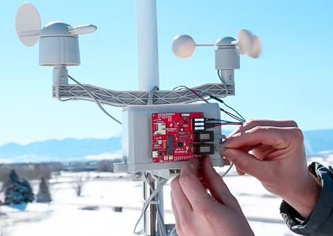 A weather meter being hooked up