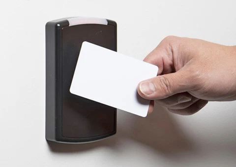 A person swiping his RFID card
