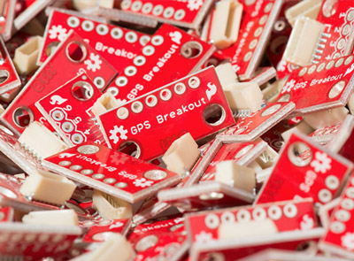 SparkFun parts in a bin. 